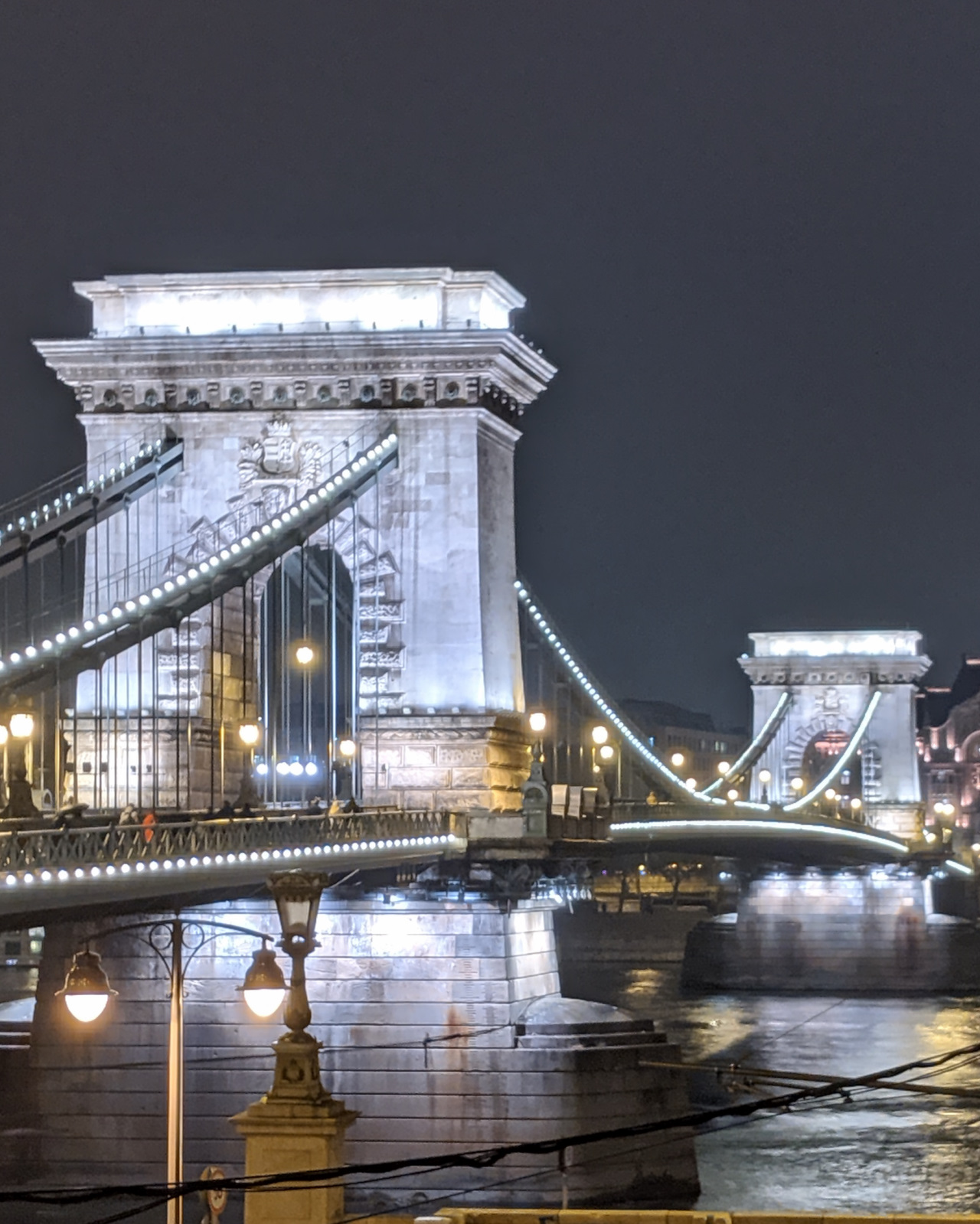 The Chain Bridge in Budapest lit up at night.